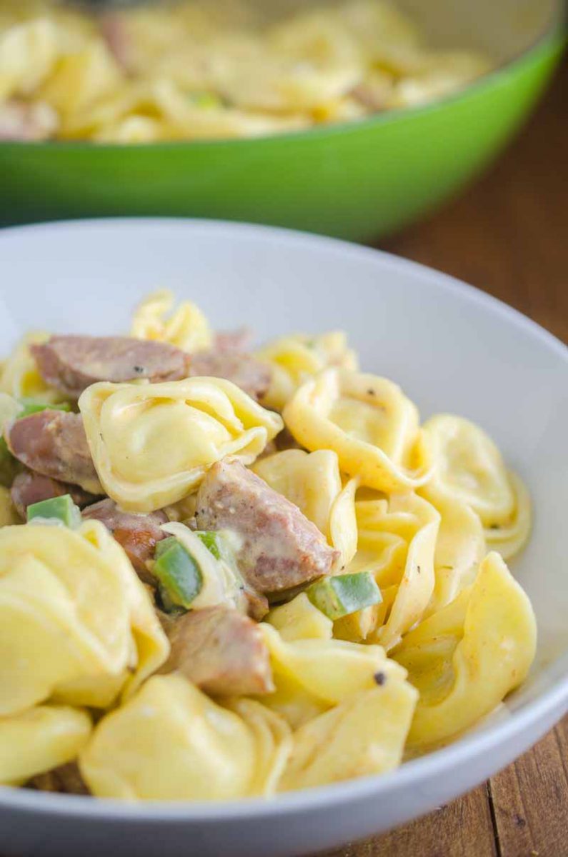 Creamy Cajun Tortellini is a decadent, spicy pasta dish that comes together in a flash. Cheesy tortellini, andouille sausage and bell peppers simmered in a creamy cajun sauce. 