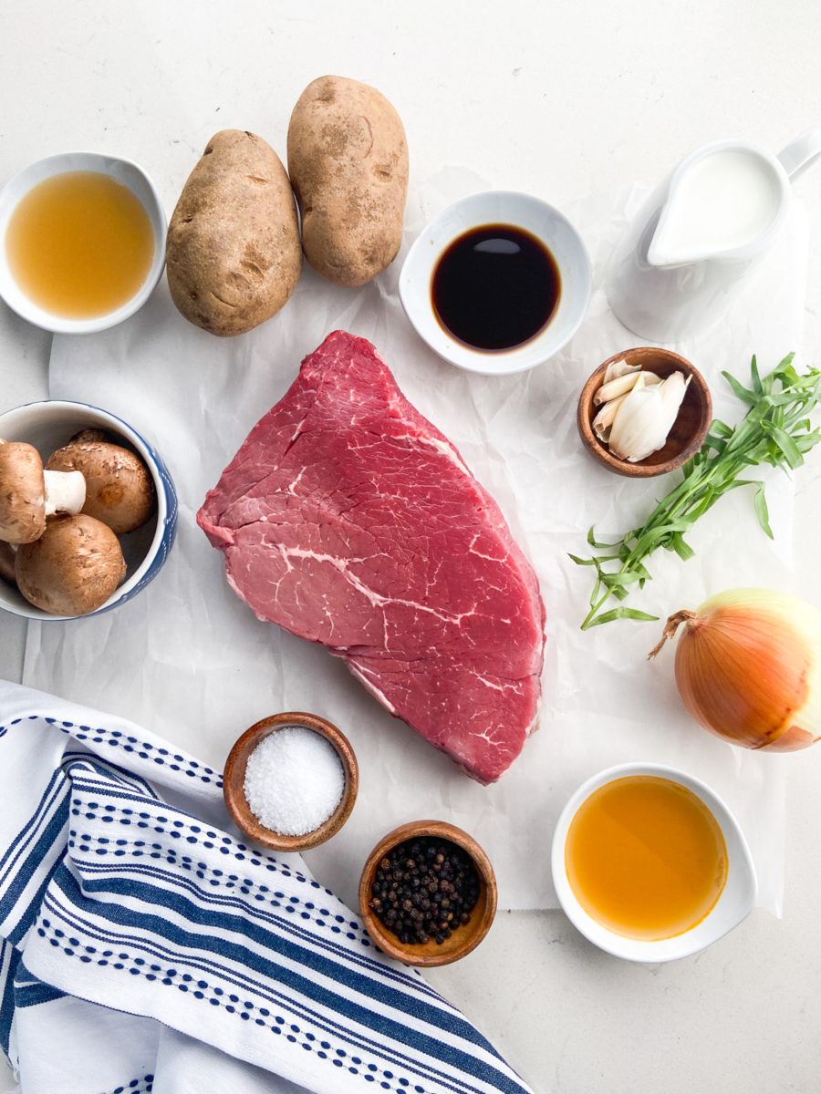 Overhead photo of steak and mushroom soup ingredients. 