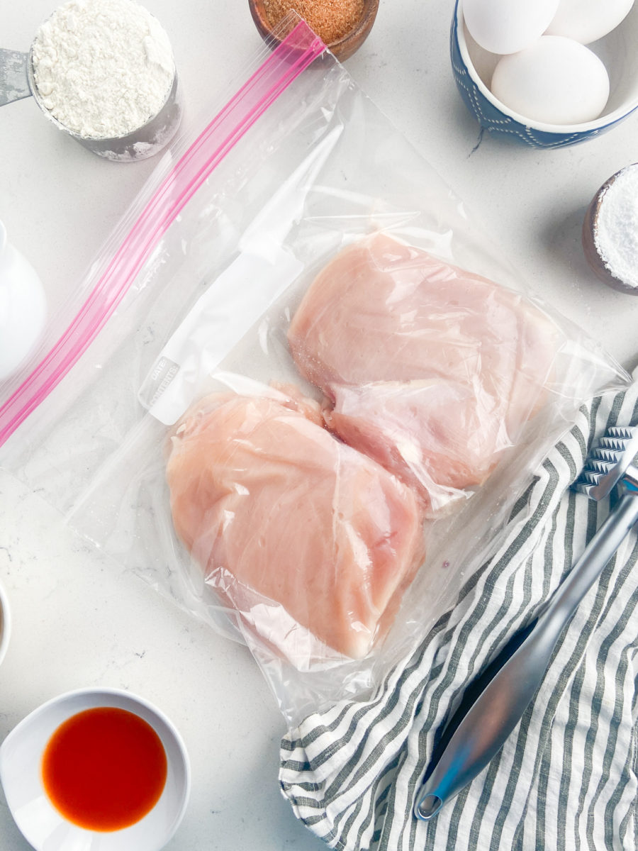 Chicken breasts in resealable plastic bag.  