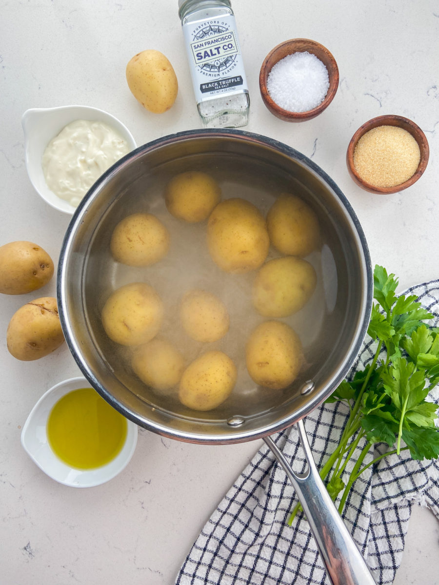 Potatoes in pot of salted water.