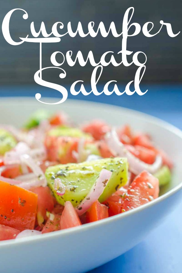 Cucumber Tomato Salad is my absolute favorite summer salad. Fresh cucumbers, summer tomatoes, shallots and a quick vinaigrette make this perfect for all of your summer cookouts.  #vegetarian #cucumbertomatosalad #salad