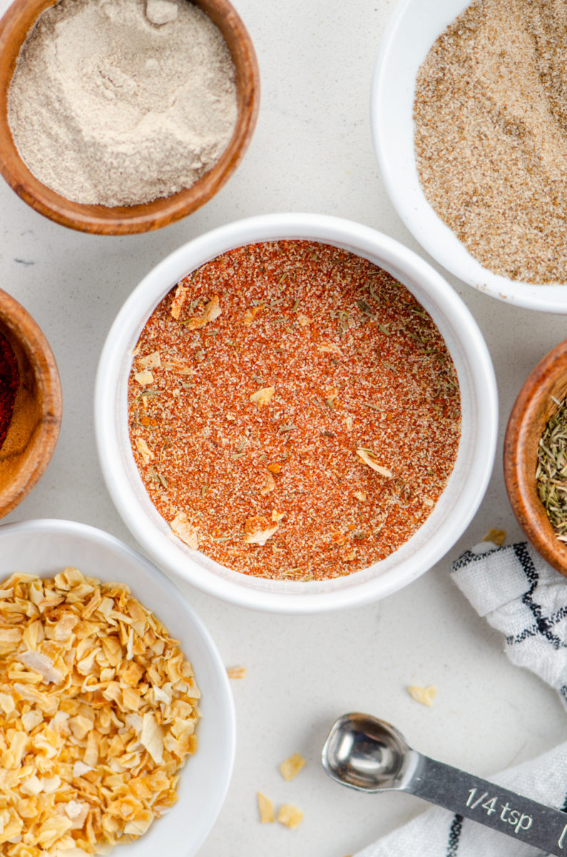 Cajun seasoning in white bowl. 