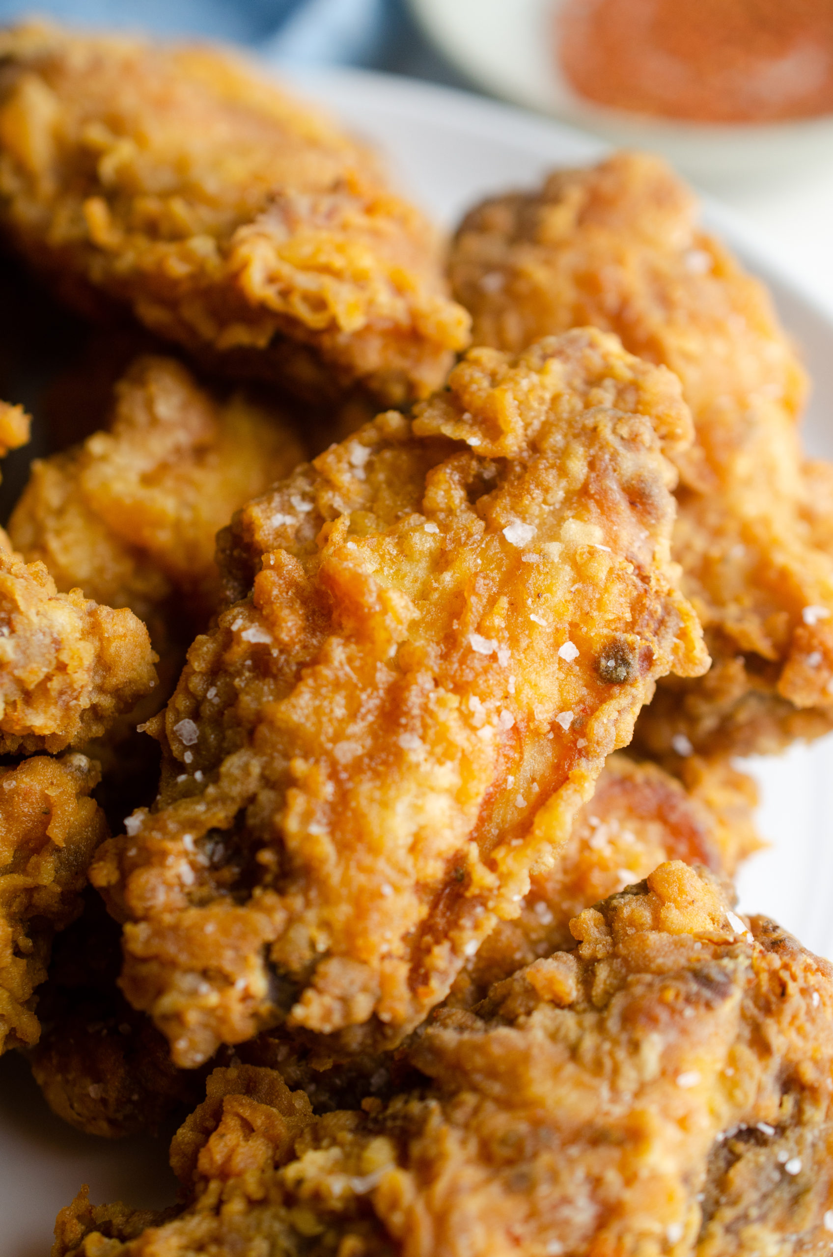 A plate of deep fried chicken wings. 