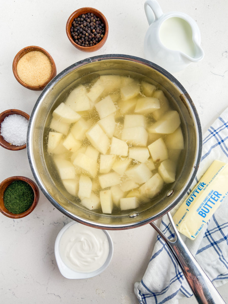 Diced potatoes in pot of  water. 