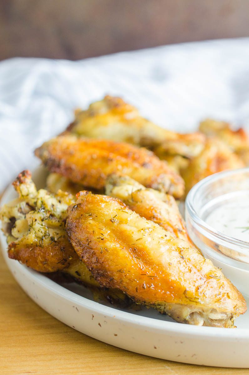 Dill Pickle Chicken Wings will be your new favorite wing! Baked Chicken Wings get a dill pickle twist with pickle brine. The whole family will love these easy baked chicken wings. 
