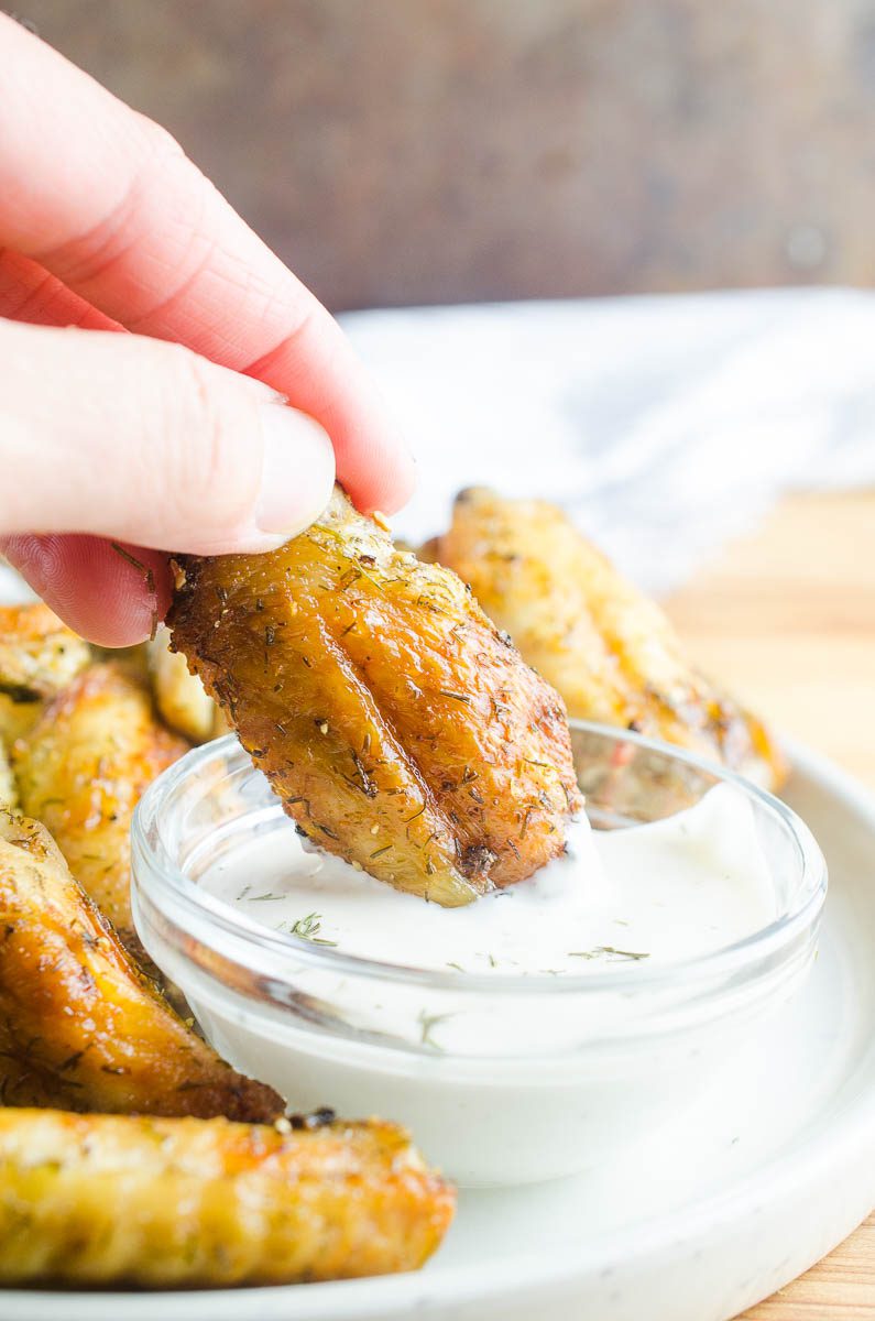 Dill Pickle Chicken Wings will be your new favorite wing! Baked Chicken Wings get a dill pickle twist with pickle brine. The whole family will love these easy baked chicken wings. 