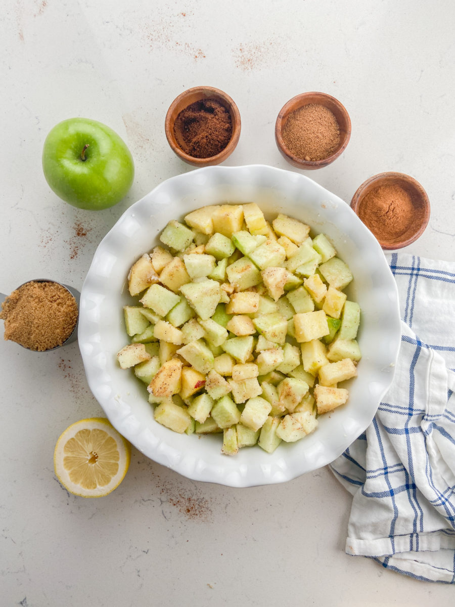 Diced apples in pie dish. 