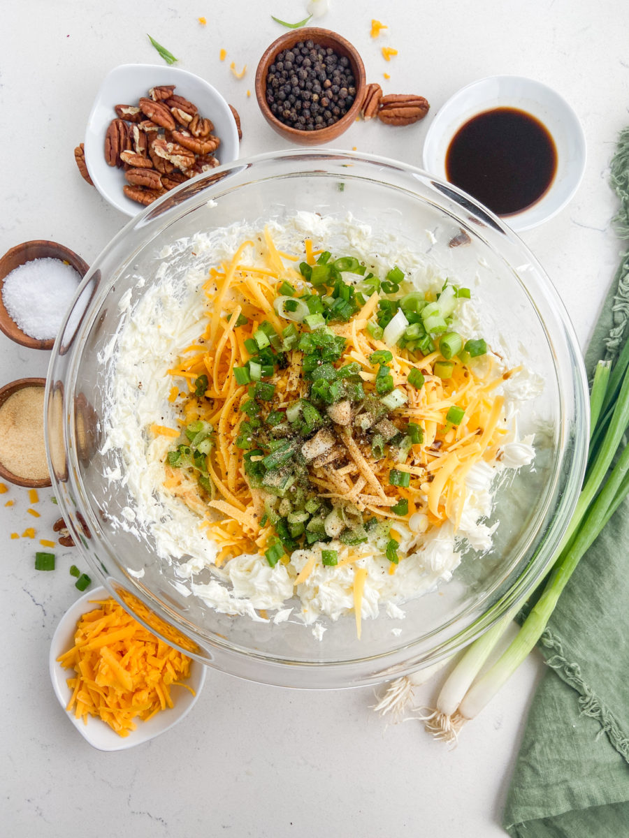 Cheese ball ingredients in glass bowl. 