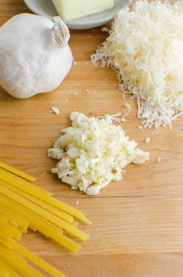 Minced garlic on a cutting board. 