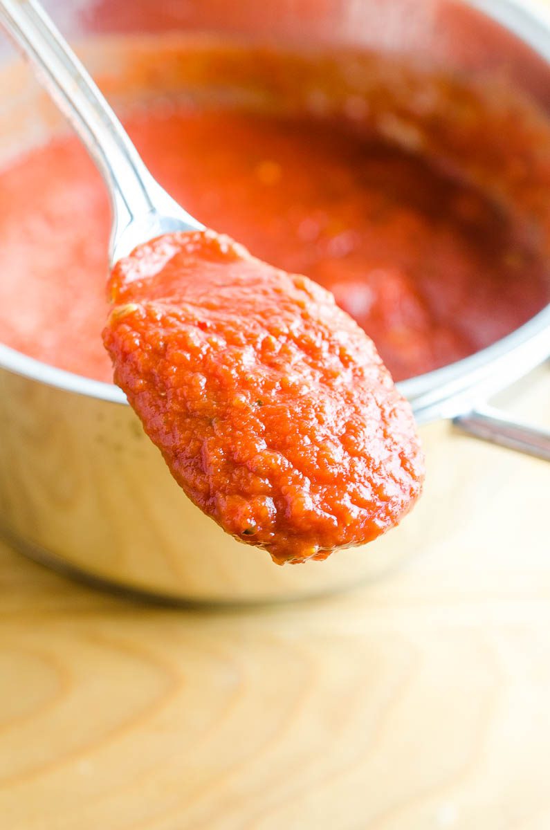 homemade pizza sauce on a spoon. 