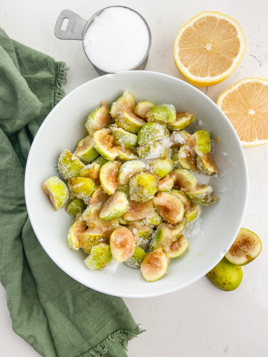 Sugared figs in a white bowl. 