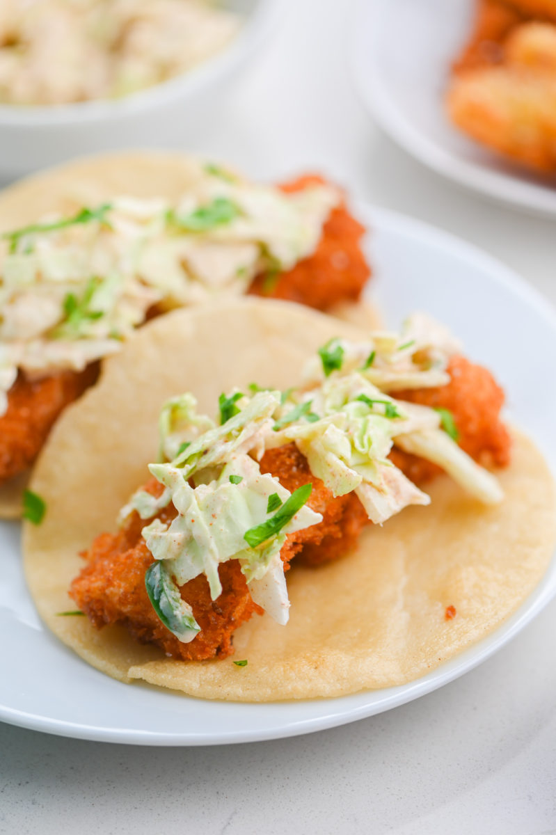 Fish tacos with slaw on a plate. 