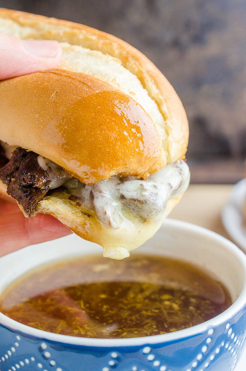 Dipping a french dip sandwich in au jus