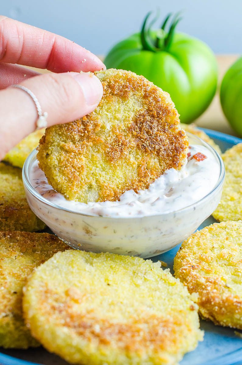 Fried green tomatoes are a classic southern dish, and this fried green tomatoes recipe kicks up the flavor, adding a bacon ranch dipping sauce to them!