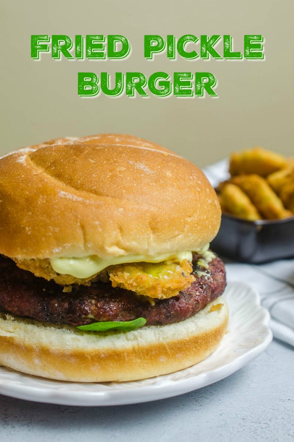 This Fried Pickle Burger is a MUST MAKE for pickle lovers. Topped with fried pickles and delectable burger sauce, it's a burger of epic proportions.  #friedpickles #burger #grilling #friedfood #dinner 
