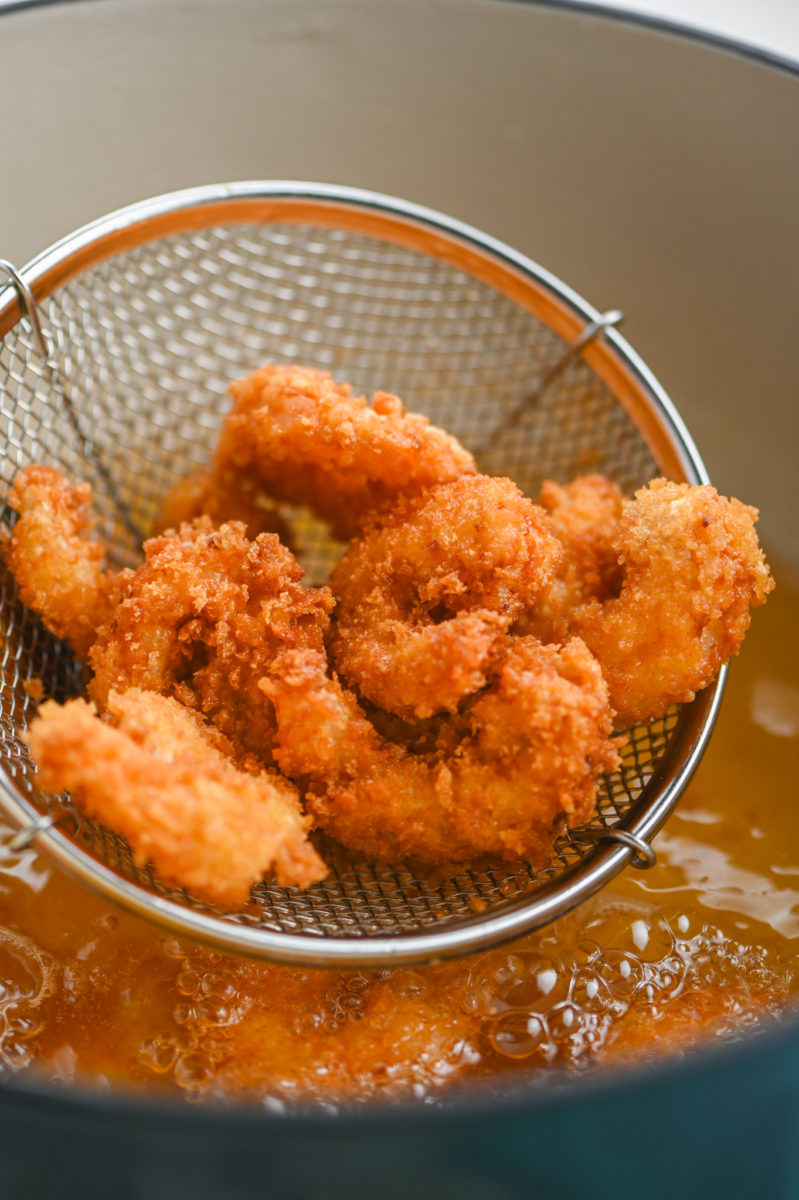 Fried shrimp in a strainer. 