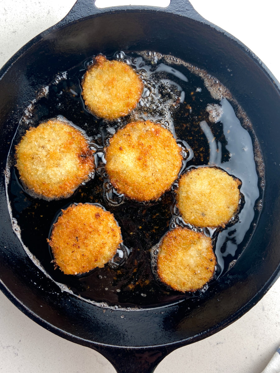 Frying tomatillos in cast iron skillet. 