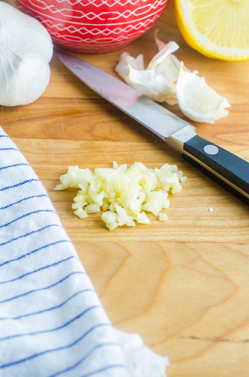 Minced garlic on a cutting board. 