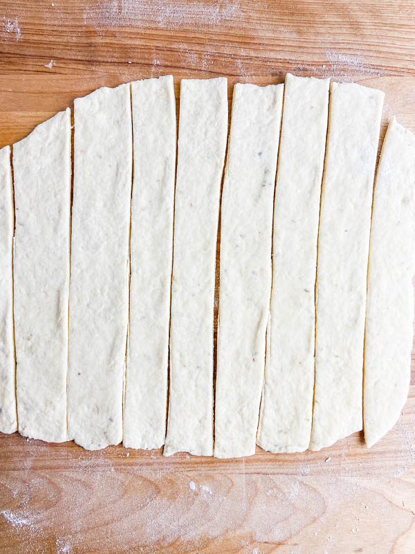Breadstick dough cut into strips.