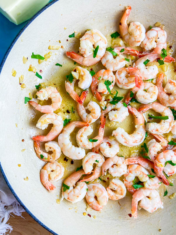 Overhead photo of garlic butter shrimp in a pan. 