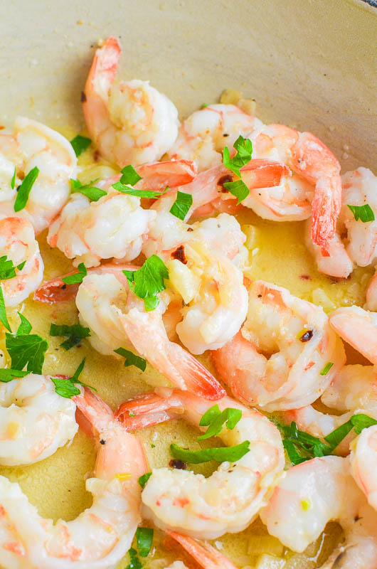 Garlic butter shrimp in a pan. 