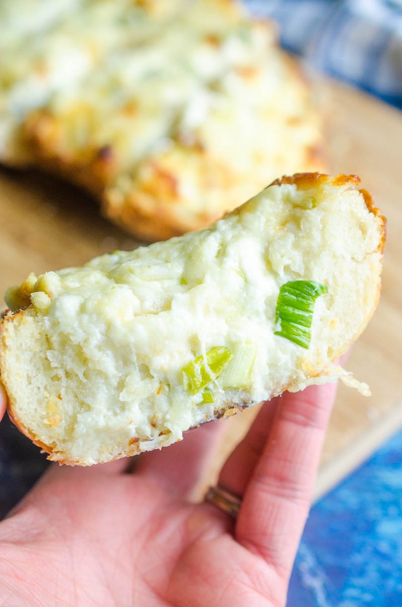 Garlic Cheese Bread with 3 cheeses and sweet roasted garlic. An easy, cheesy bread that is a perfect side dish or a meal in itself!