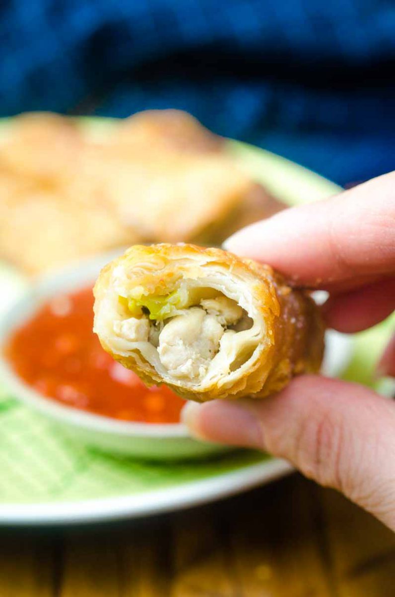 Crispy Ginger Chicken Egg Rolls are loaded with ground chicken, fresh ginger, mushrooms, green onions and cilantro. A classic Asian appetizer!