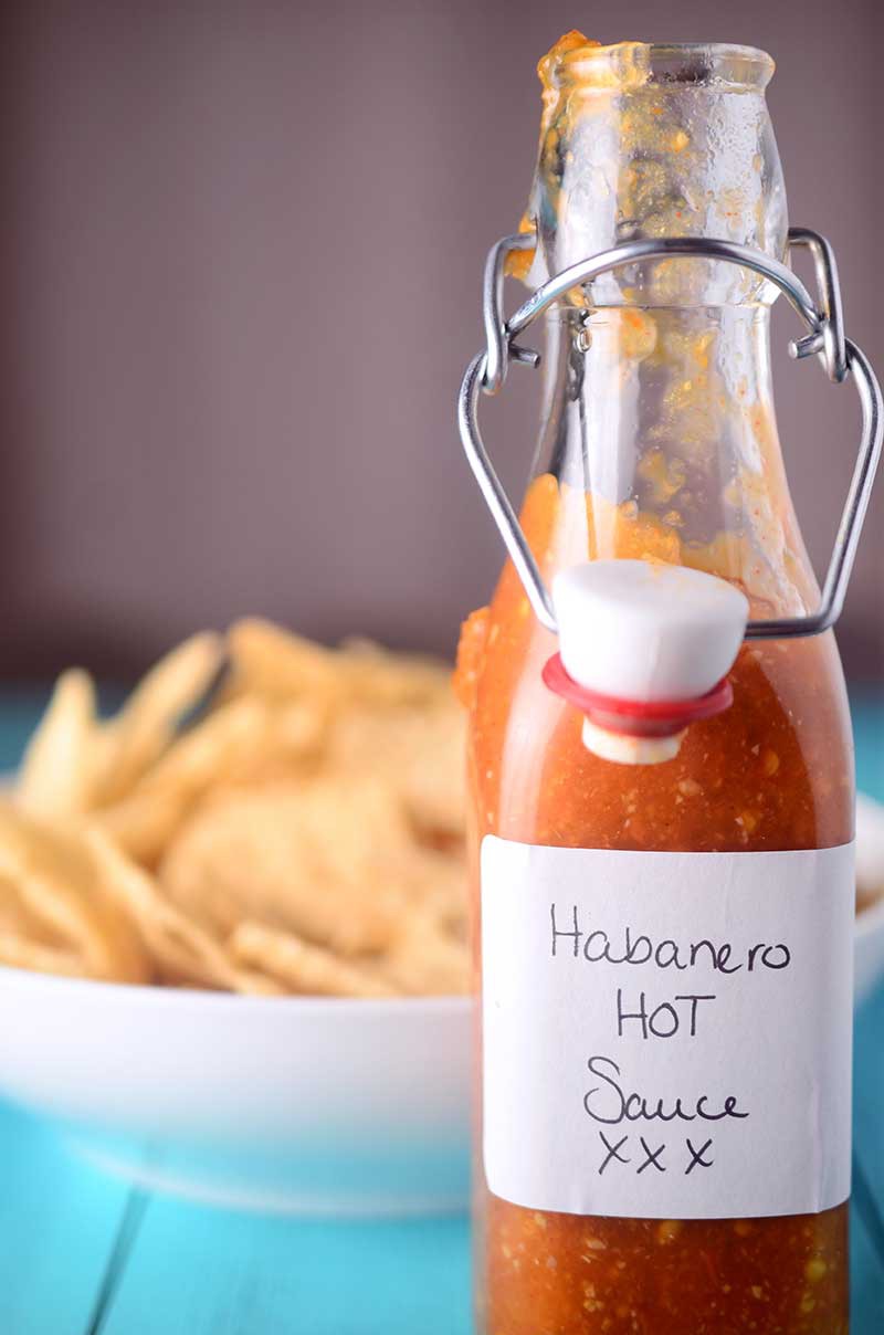 Habanero hot sauce is a homemade hot sauce, bursting with spicy flavor. This easy condiment recipe isn't for the faint of heart, but if you love habanero peppers, you will love it!