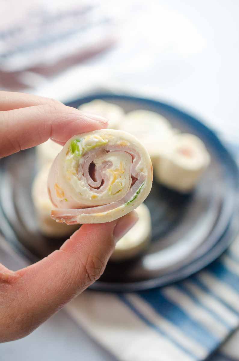 Easy Ham Roll Ups are a quick and easy appetizer that is perfect for tailgating, parties and even the kiddos lunches!