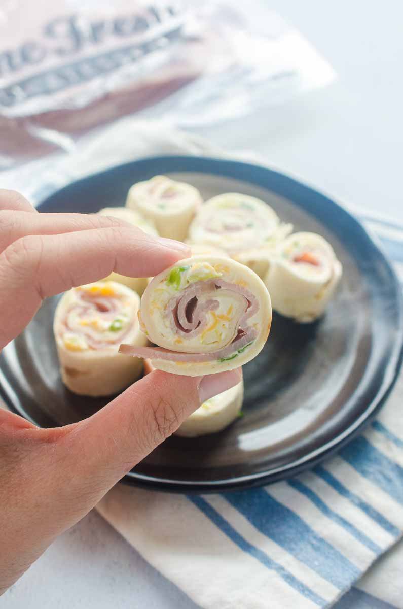 Easy Ham Roll Ups are a quick and easy appetizer that is perfect for tailgating, parties and even the kiddos lunches!