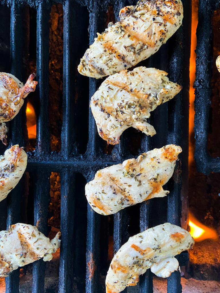 Chicken tenders on a grill. 