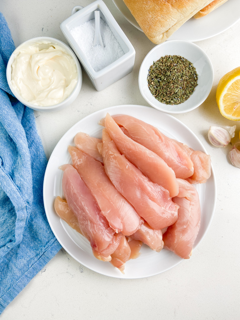 Overhead photo of ingredients needed to make grilled chicken sandwich. 