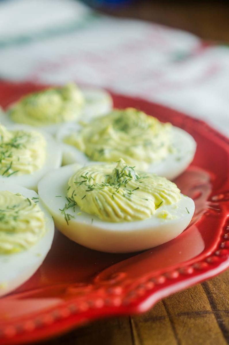 Herbed Deviled Eggs are an herby twist on a classic. With chives, dill and sour cream the creamy filling makes these irresistible. 