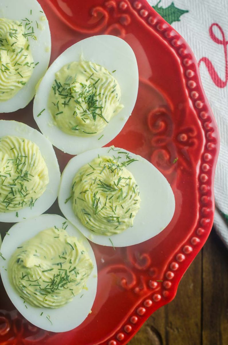 Herbed Deviled Eggs are an herby twist on a classic. With chives, dill and sour cream the creamy filling makes these irresistible. 