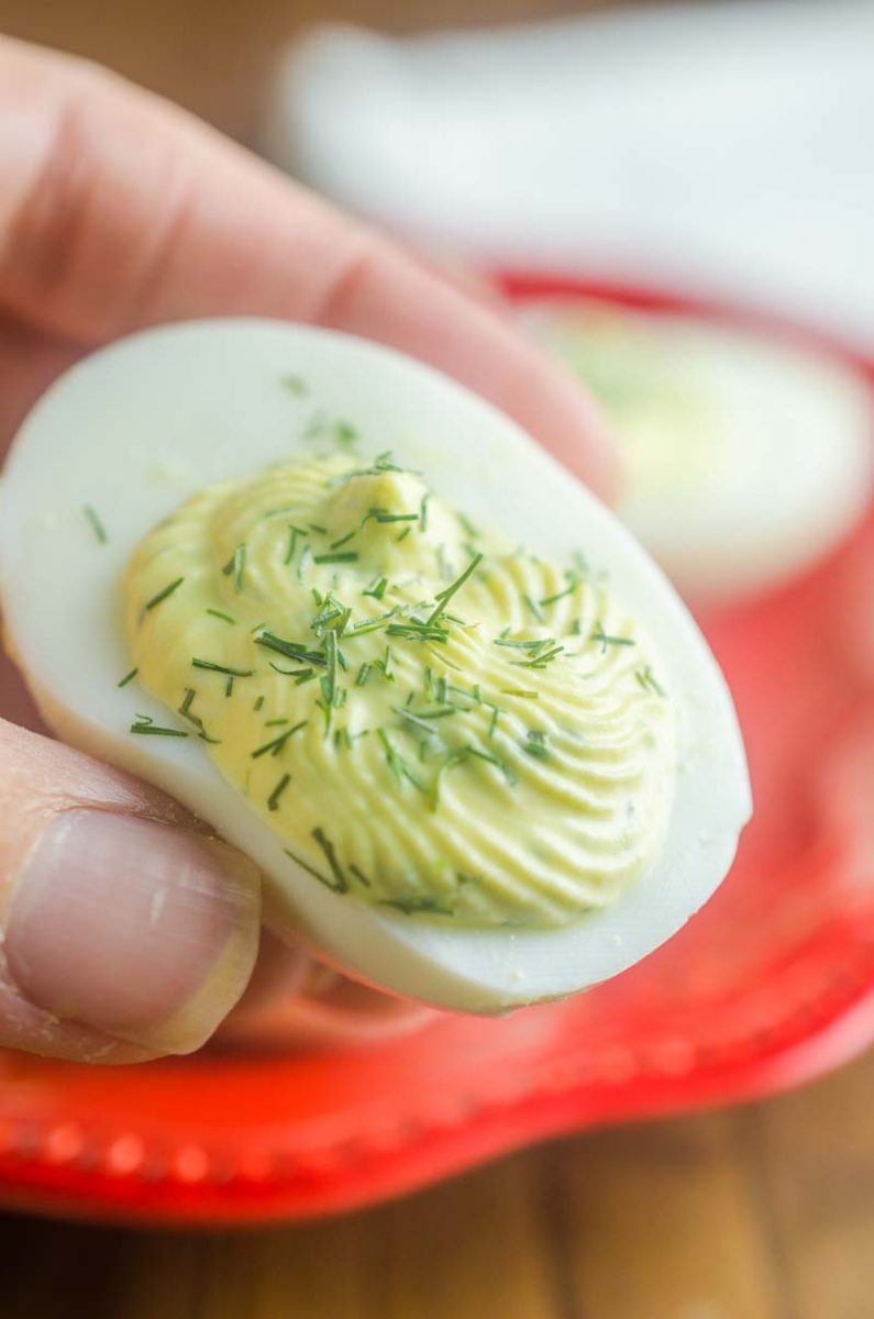 Herbed Deviled Eggs are an herby twist on a classic. With chives, dill and sour cream the creamy filling makes these irresistible. 