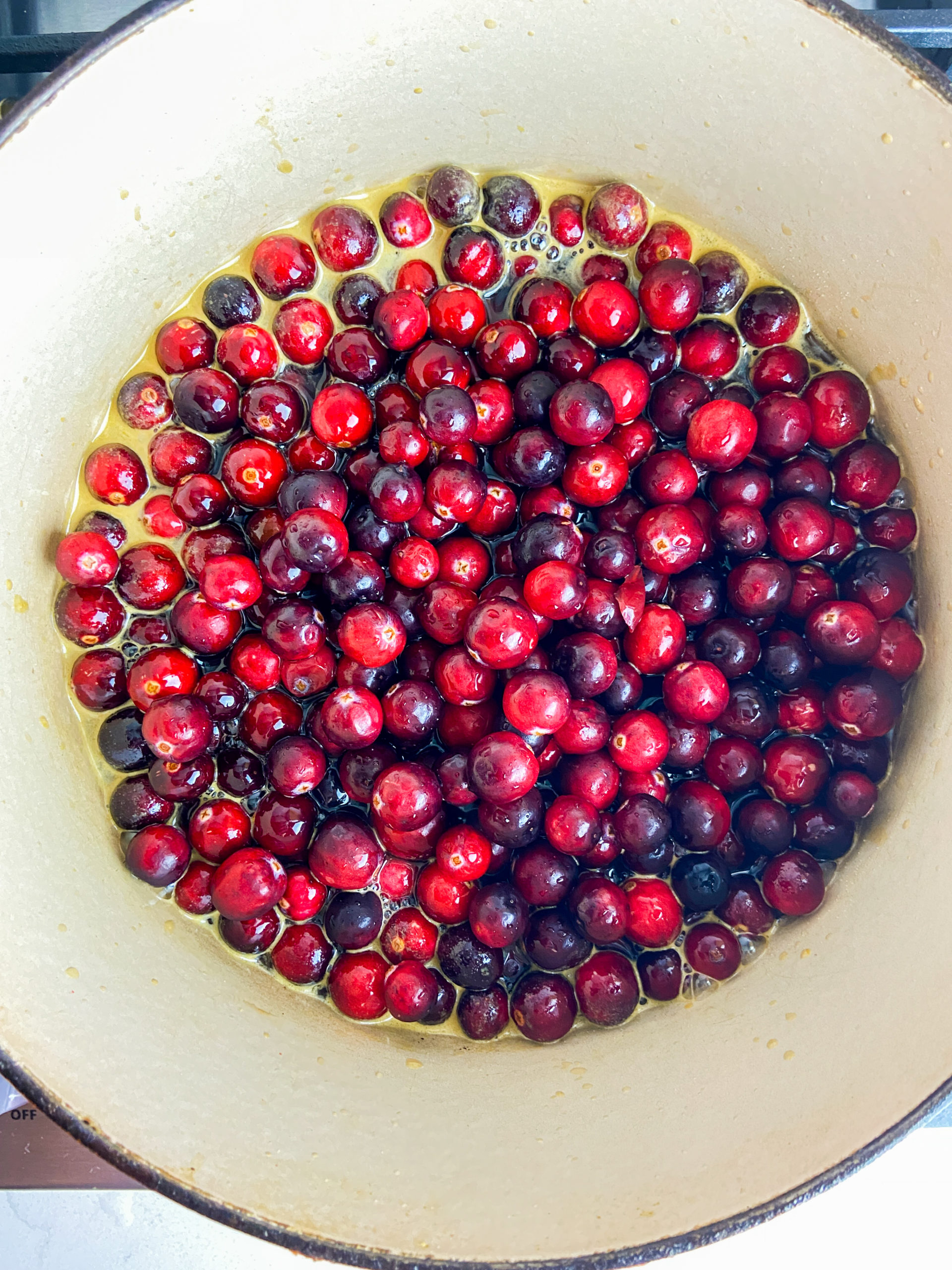 Overhead photo of cranberries in pot. 