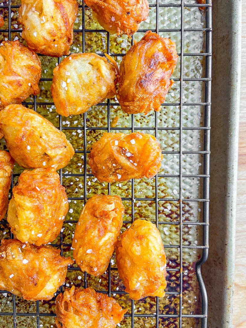 Homemade Tater Tots on a cooling rack.