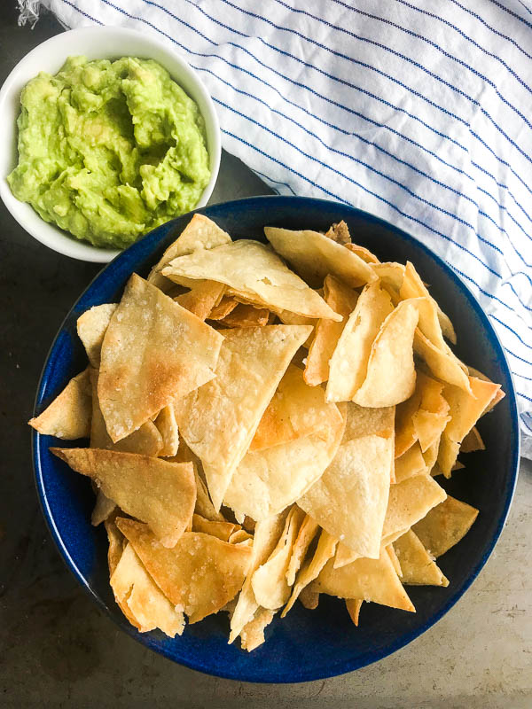 All you need to make your own homemade tortilla chips is 3 ingredients and 15 minutes in the oven. They are great for dipping in all the things! 