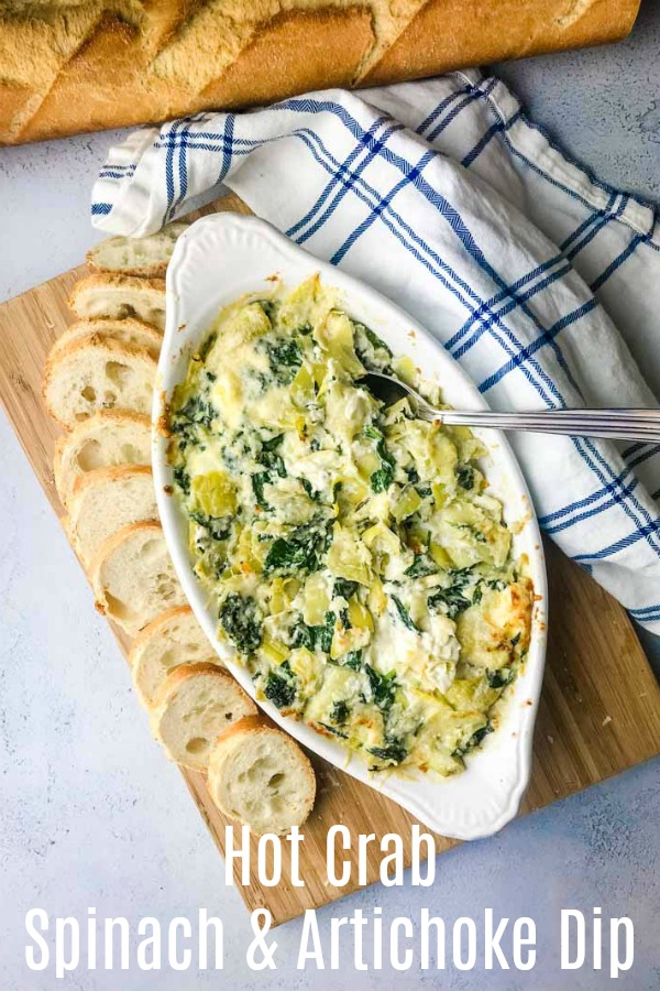 Decadent Hot Crab Spinach Artichoke Dip is a must for parties this season! If you love spinach artichoke dip, you will love this version with crab!  #crabdip #spinachartichokedip #dip #appetizer 