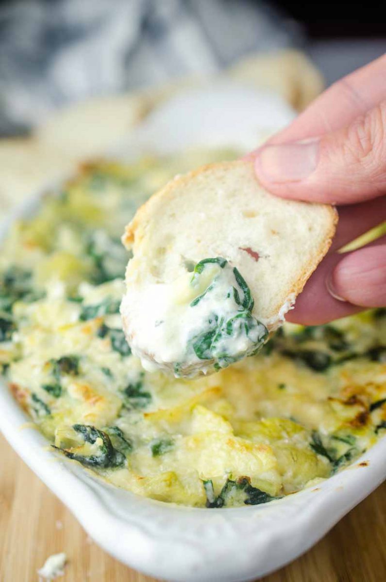 Decadent Hot Crab Spinach Artichoke Dip is a must for parties this season! If you love spinach artichoke dip, you will love this version with crab! 