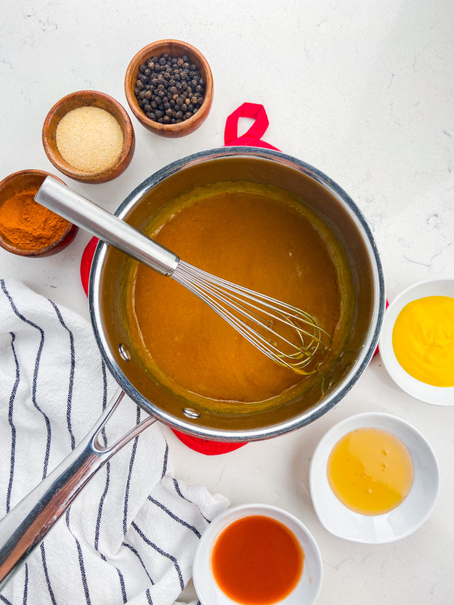 Hot honey mustard wing sauce in a pan. 
