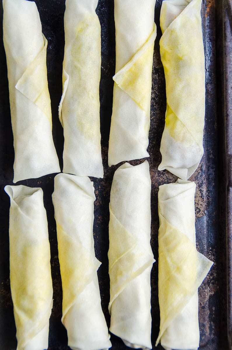 Lumpia on baking sheet for freezing. 