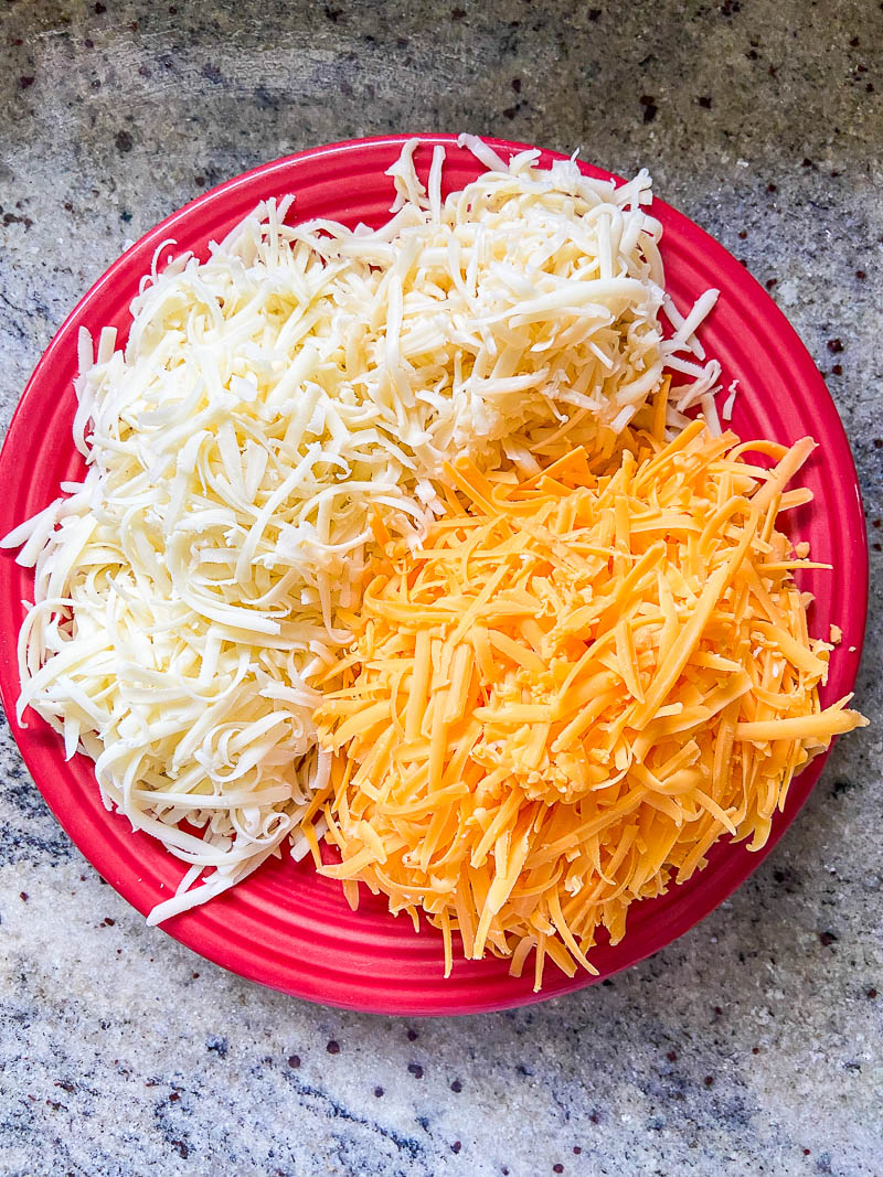 3 cheeses on a red plate 