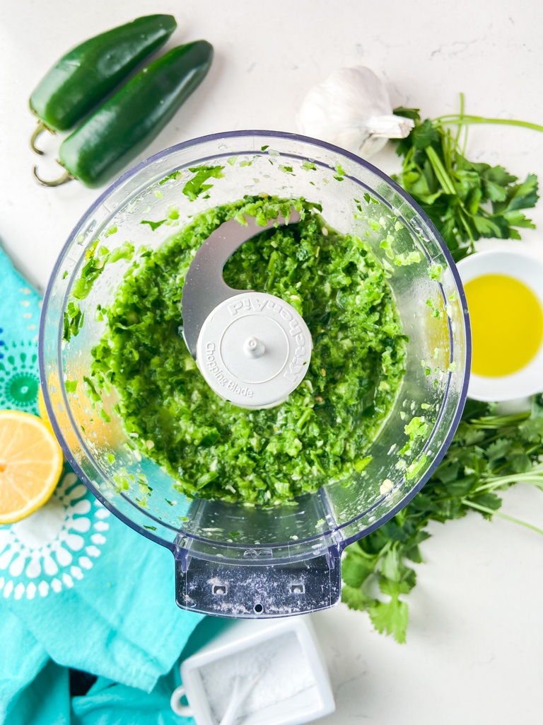 Overhead photo of jalapeno salsa in a food processor. 