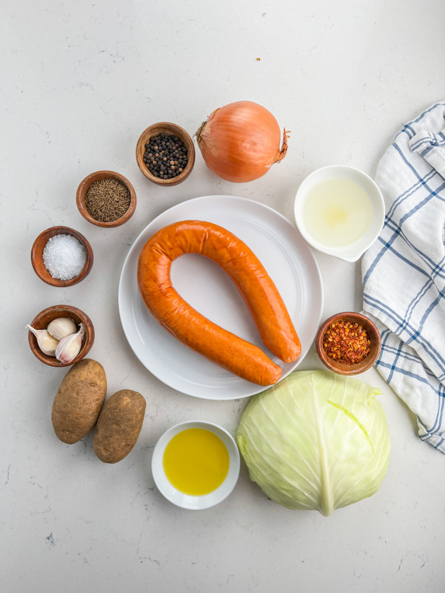 Overhead photo of kielbasa cabbage soup ingredients. 