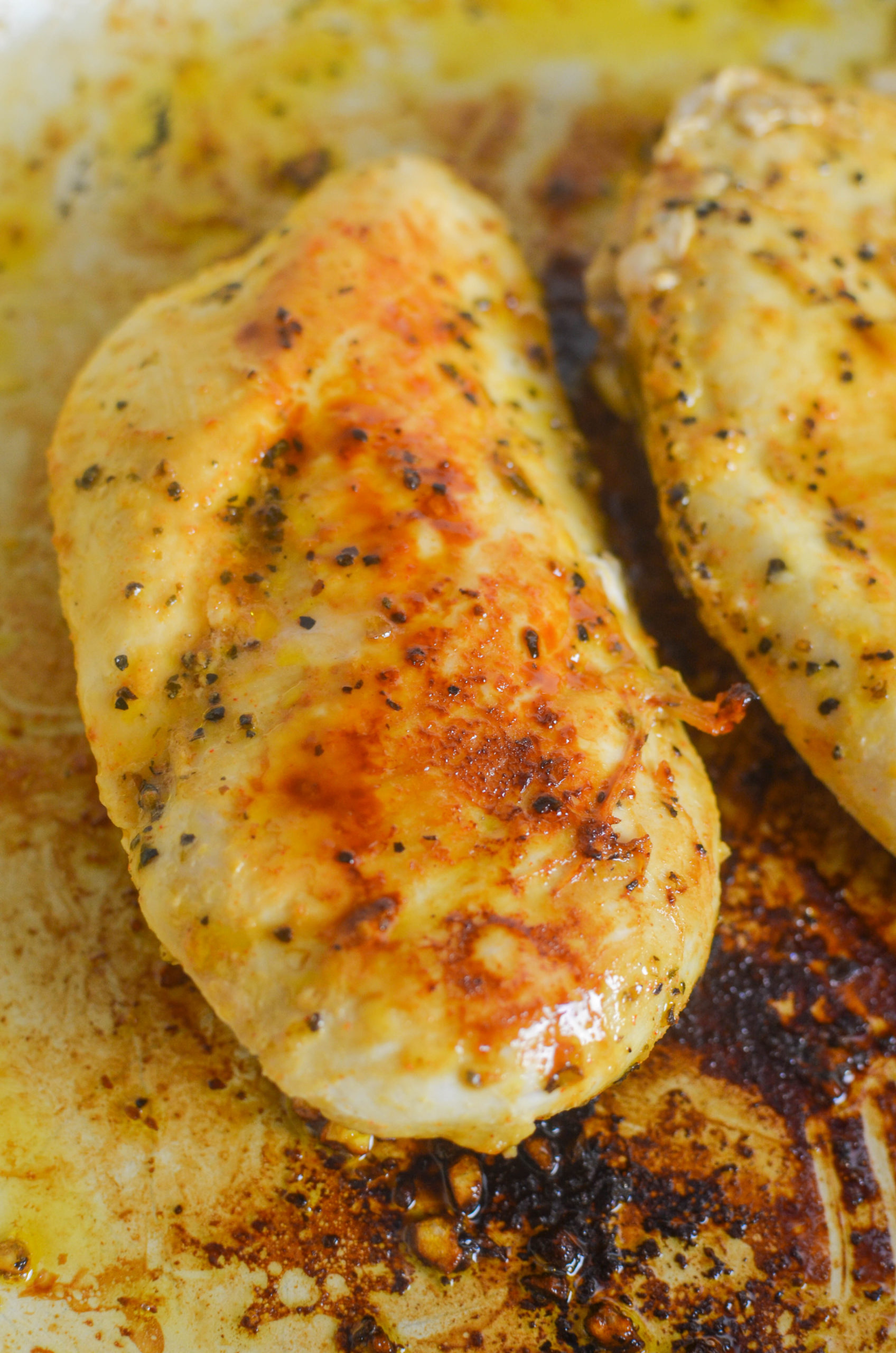 Browning chicken breast in a skillet. 