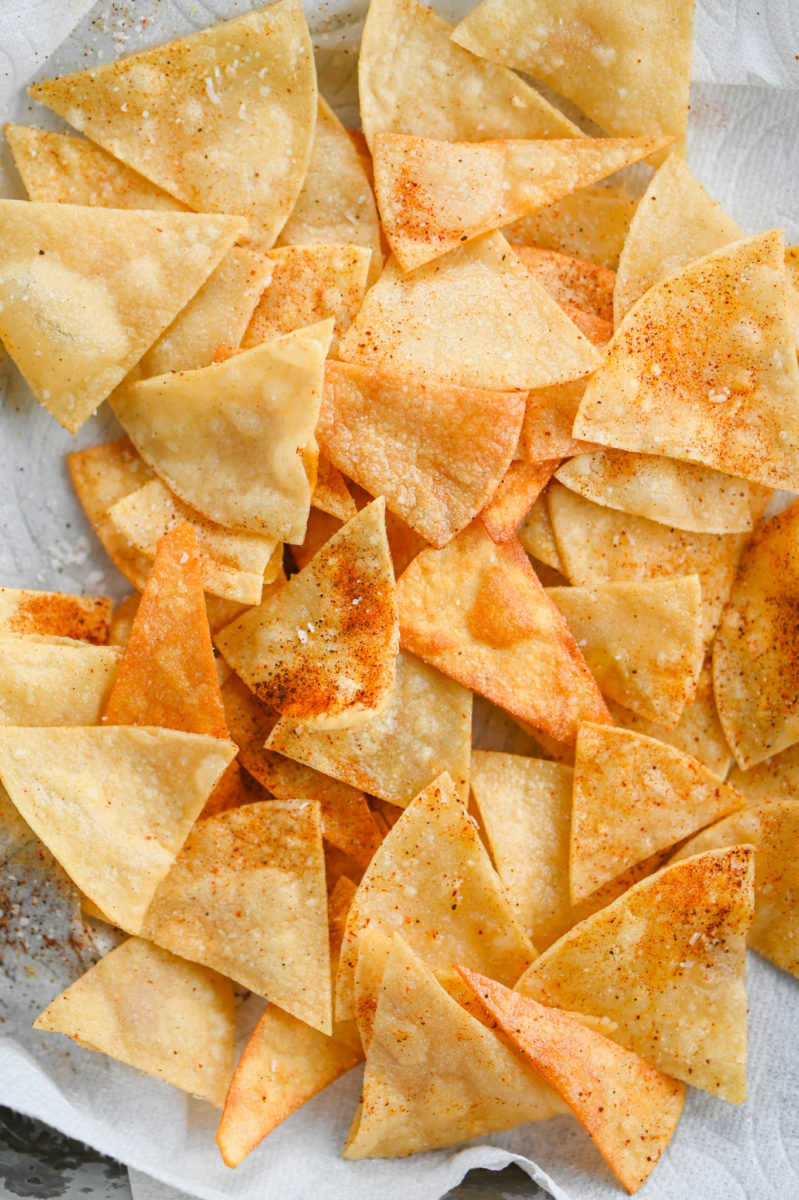 Lime Tortilla Chips on paper towel lined plate. 