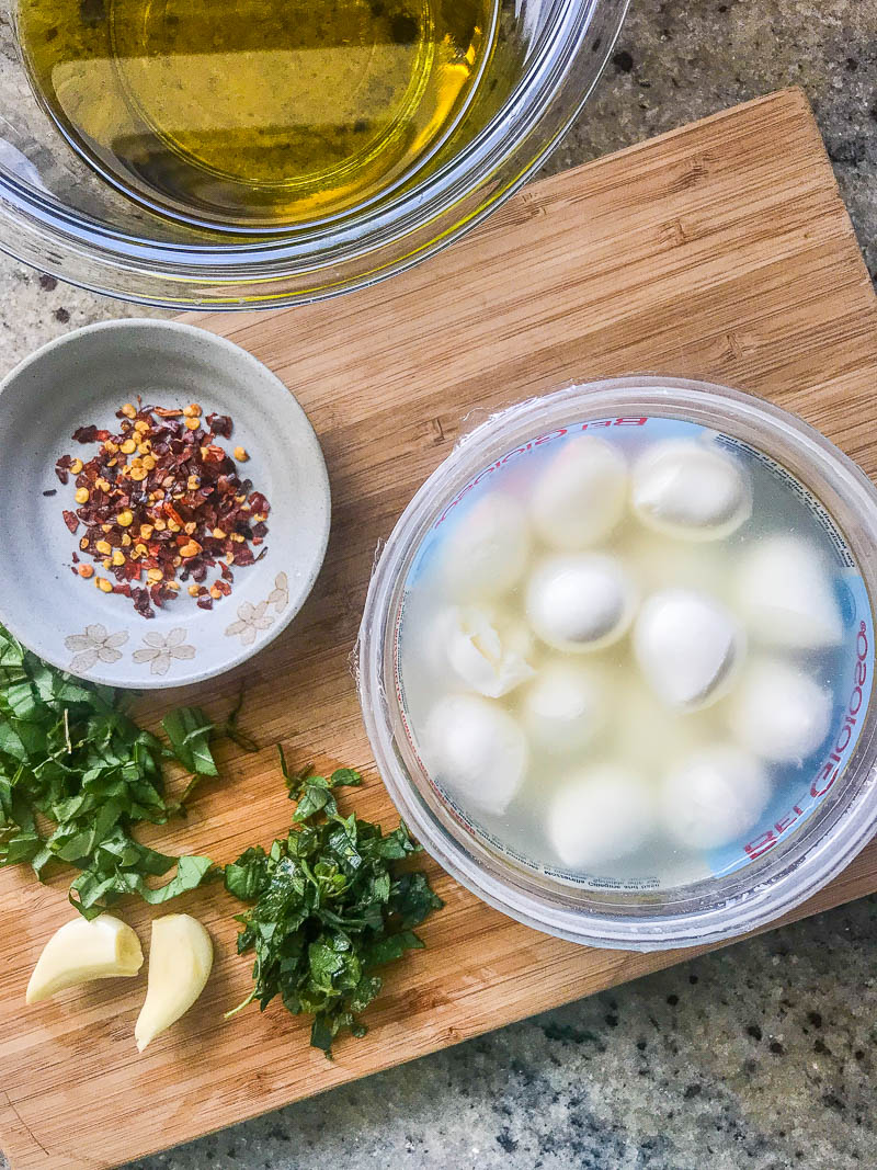 Marinated mozzarella may be the easiest appetizer recipe ever. The cheese soaks up a simple but flavorful marinade, making this bite sized cheese appetizer completely crave-worthy.