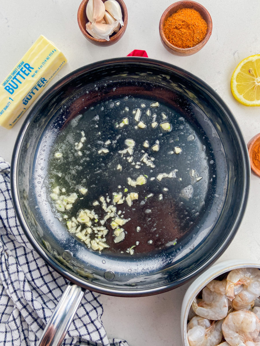 Garlic sautéed in butter in skillet.