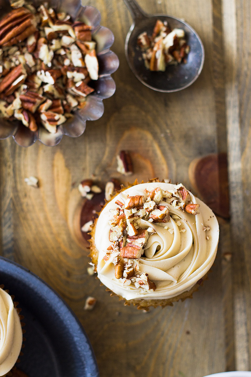 These Pecan Pie Cupcakes are light, fluffy, moist and studded with pecans. Then topped with a creamy pecan pie frosting!